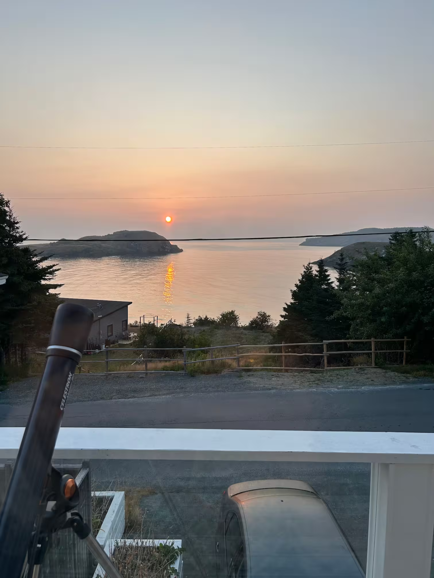 Sunrise over the North Atlantic, rising between two islands offshore from the Archangel Studios residence in St. Michael's, Newfoundland.