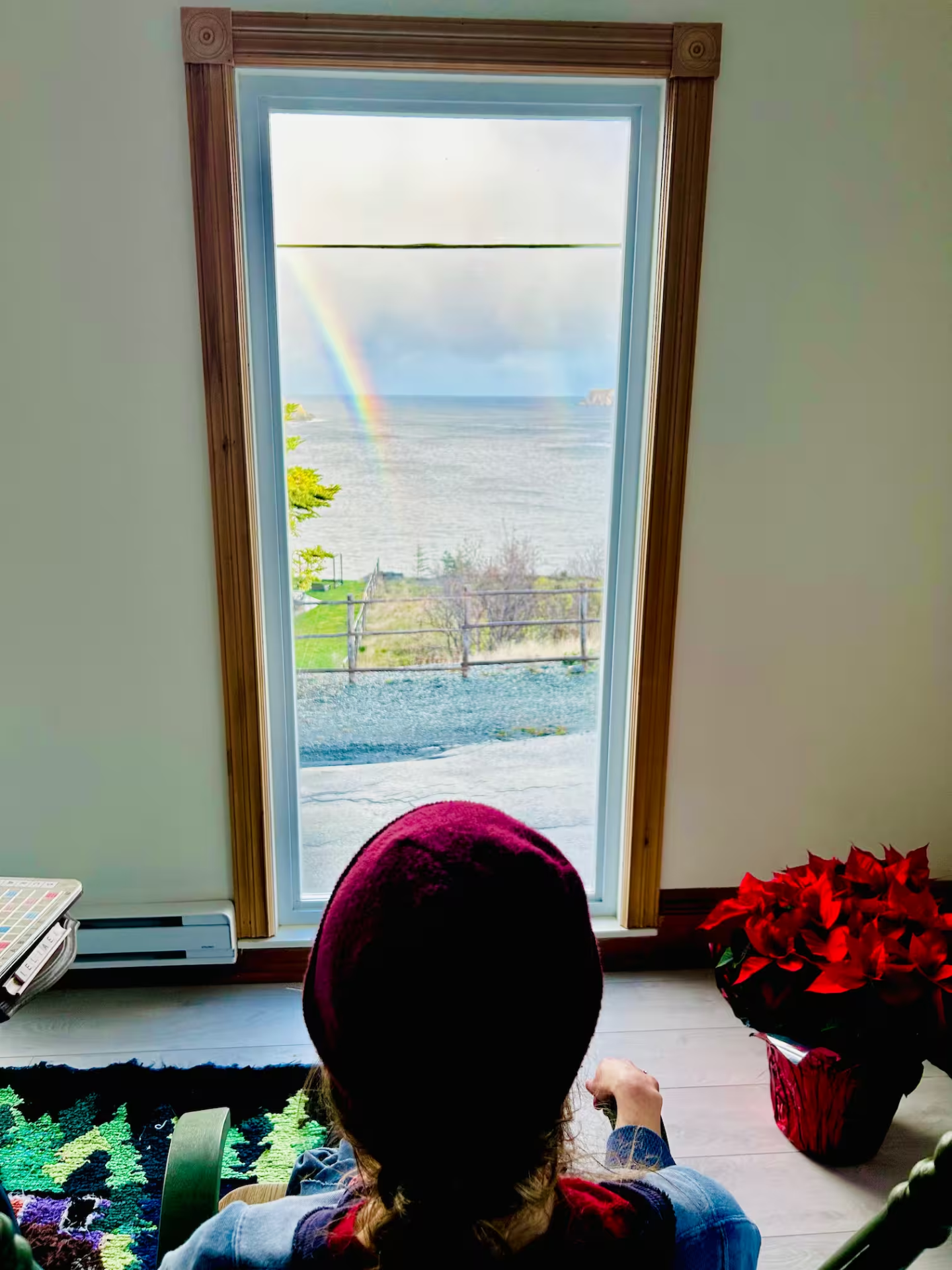 A rainbow over the North Atlantic seen from a window at Archangel Studios.